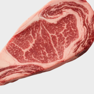 Marbled raw steak on a white background